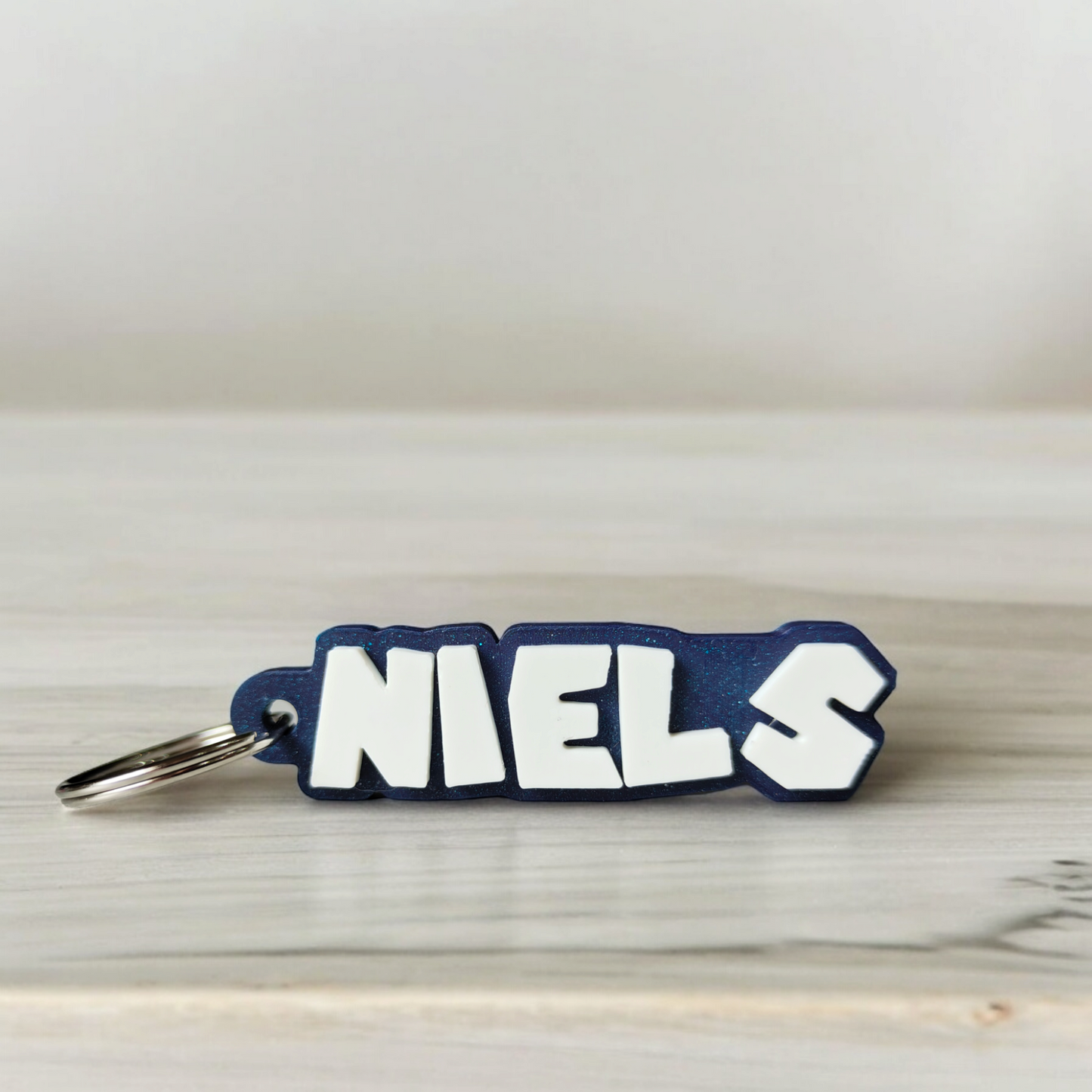 leutelhanger met naam super mario  glitter blauw wit