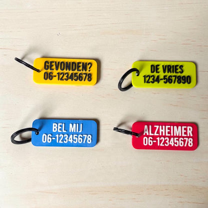 Sleutelhanger met naam en telefoonnummer